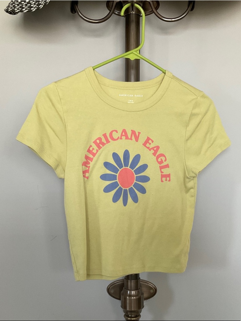 American Eagle Outfitters Yellow Tee with Blue and Pink Daisy Graphic